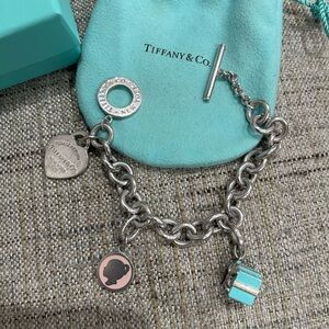 Tiffany & Co. Silver  heart Tag toggle with girl face charm Tiffany box charm